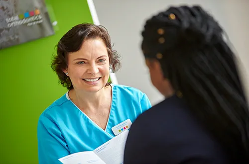 Orthodontist at Total Orthodontics Lewisham talking a patient through treatment options