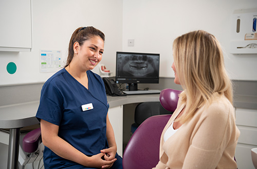 Total Orthodontics orthodontist with patient in practice