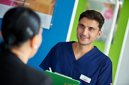 Orthodontist at Total Orthodontics discussing treatment with patient