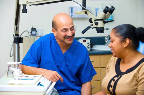 a patient discusses treatment with her dentist to help her overcome her fear of the orthodontist 