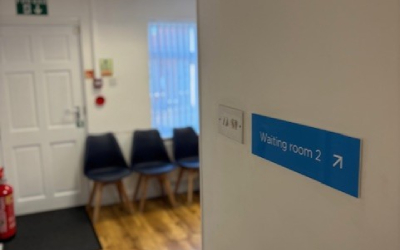 Blue chairs for patient use in the waiting area
