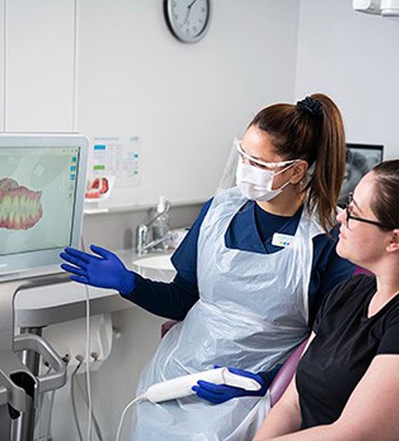 Dentist showing Patient their mouth