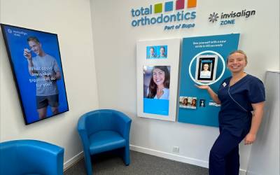 Trainee dental nurse Lottie shows off the Invisalign aligner result simulator