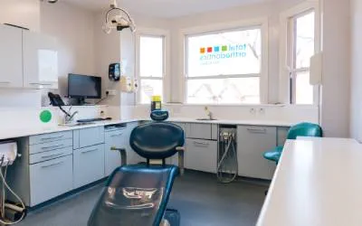 Blue dentists chair and modern well equipped surgery