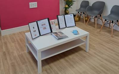 Awards won by the practice and information displayed for the patients on a table