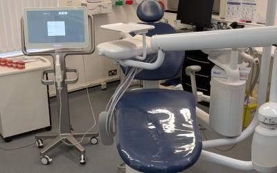 Dentists chair with tool and equipment and screen