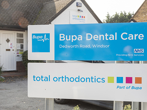 Total Orthodontics Windsor enterior featuring Bupa Dental Care and Total Orthodontics logos